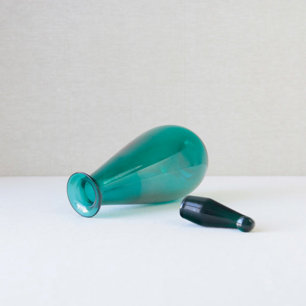 Nanny Still SV glass decanter produced by Riihimaen Lasi Oy, a mid-century Scandinavian design in rich turquoise glass.