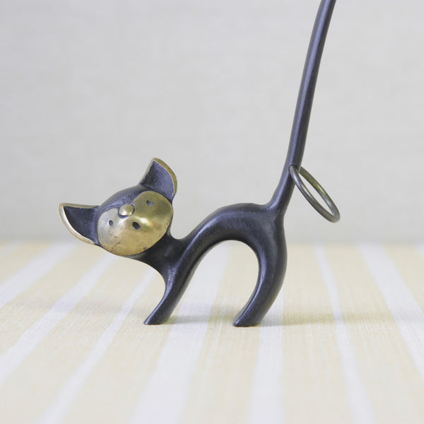 A whimsical, genuine Walter Bosse brass cat pretzel holder from 1950s Vienna. Created in collaboration with Herta Baller, this piece reflects Bosse’s unique Modernist style and is a must-have for collectors of Viennese metalwork.