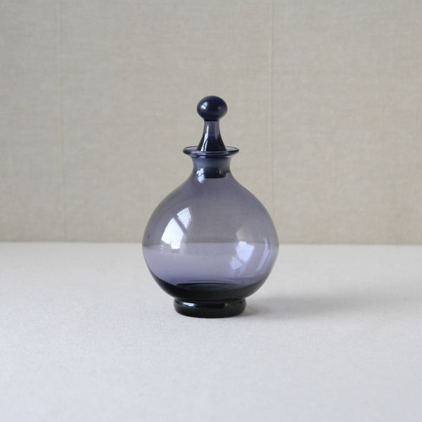 Collectable Tamara Aladin 1750 lilac vinegar bottle, crafted by Riihimaki Glassworks in the 1960s, showcasing organic modern elegance.