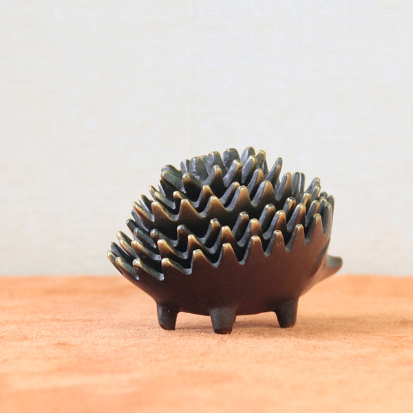 Sleek and elegant, this genuine Walter Bosse hedgehog ashtray exemplifies Modernist design. A rare piece crafted with the exceptional quality of mid-century Viennese metal art.