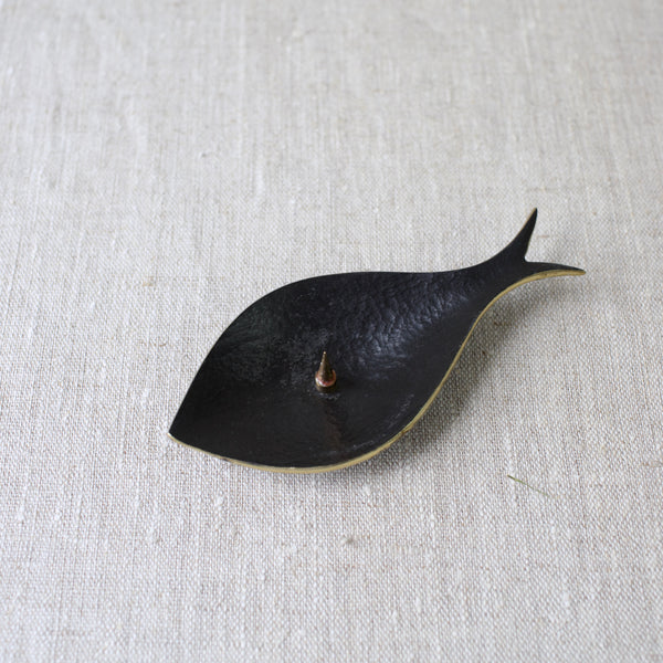 A genuine early Walter Bosse Modernist brass fish candle holder, made by Herta Baller in the 1950s. Bosse’s signature blend of form and function shines through in this rare piece.