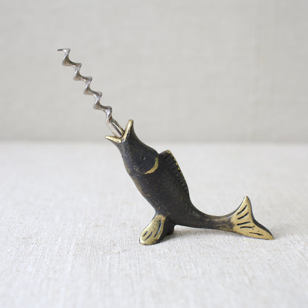 This 1950s brass fish corkscrew by Walter Bosse showcases his Modernist aesthetic, produced by Herta Baller in Vienna. A charming collectible piece from mid-century Austrian design.