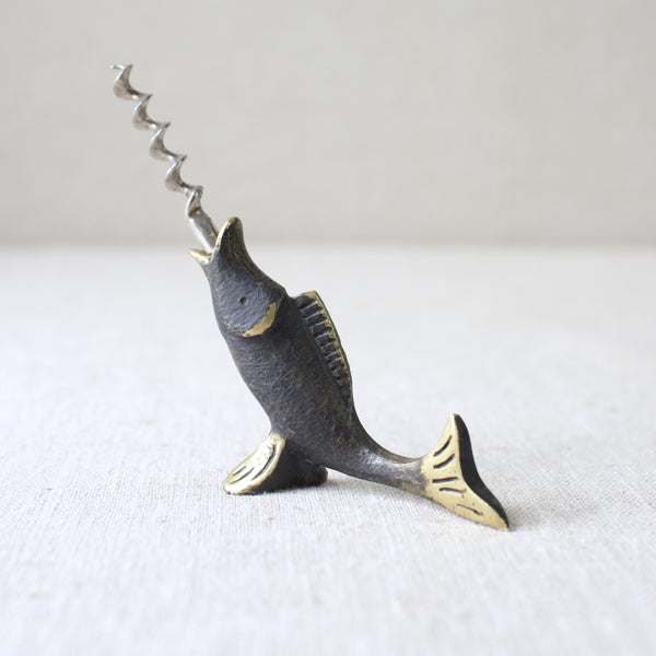 This early genuine Walter Bosse brass fish corkscrew was produced by Herta Baller in the 1950s. The piece is a stunning example of mid-century Modernist metalwork from Austria, celebrated for its whimsical charm.