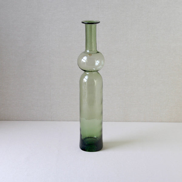 Vintage Neptuna vase designed by Nanny Still and produced by Riihimaki Glassworks, pale green glass with mid-century modern appeal.