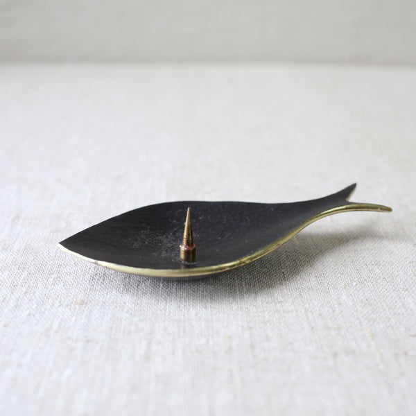 A vintage Walter Bosse brass fish candle holder, crafted in the 1950s by Herta Baller. This rare Modernist design reflects the mid-century focus on sleek, minimalist forms combined with playful details.