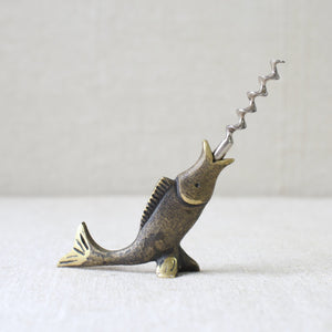 This rare brass fish corkscrew by Walter Bosse, crafted by Herta Baller in 1950s Vienna, is a perfect representation of mid-century Modernist metalwork from Austria.