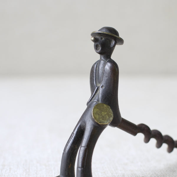 This vintage Richard Rohac "Vagabond" corkscrew from the 1950s is made from patinated brass, exemplifying the bold yet whimsical spirit of mid-century Modernist metalwork from Vienna.