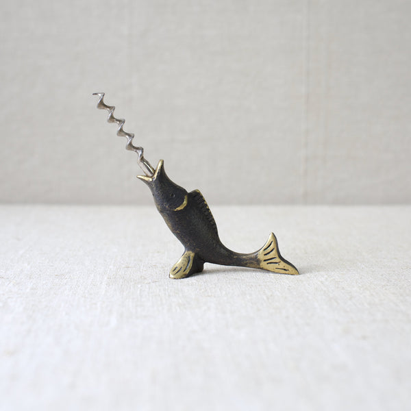 A rare Walter Bosse brass fish corkscrew, produced by Herta Baller in 1950s Vienna. This piece is highly valued by collectors of mid-century Modernist design.