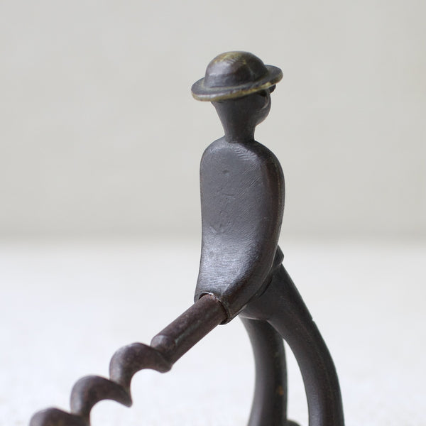 This rare 1950s "Vagabond" man corkscrew by Richard Rohac is made of brass and features a unique Modernist design from the Austrian metalworking tradition in Vienna.