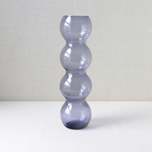 Rare Carnevaali vase by Nanny Still for Riihimaen Lasi, crafted in pale purple glass with a playful stacked sphere form, ideal for modernist homewares collectors.