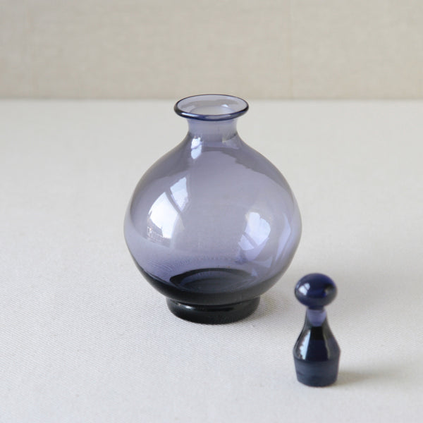 1960s Tamara Aladin 1750 vinegar bottle by Riihimaen Lasi, a unique design in lilac purple, perfect for lovers of modernist homewares.