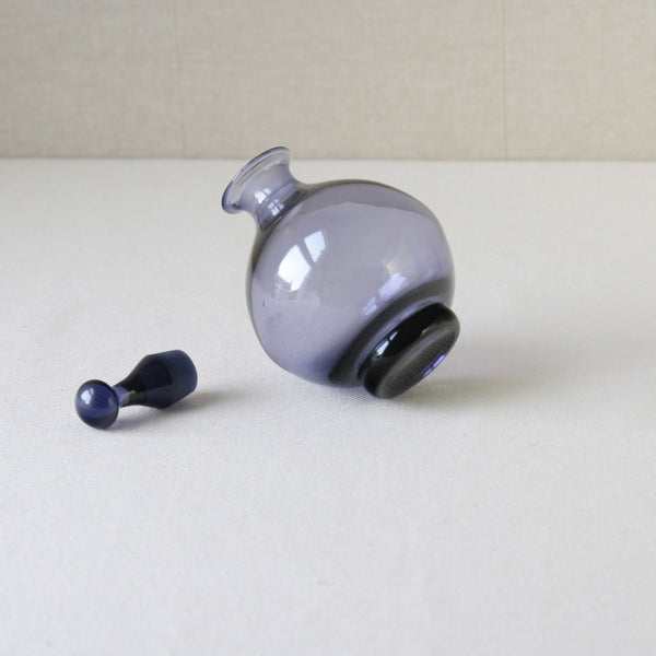 Tamara Aladin model 1750 lilac vinegar bottle, produced by Riihimaki, a rare and elegant addition to Scandinavian design collections.