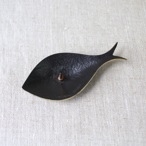 This is an early and genuine Walter Bosse fish candle holder made from brass in the 1950s. Produced by Herta Baller in Austria, this item is a true example of collectible Modernist craftsmanship.