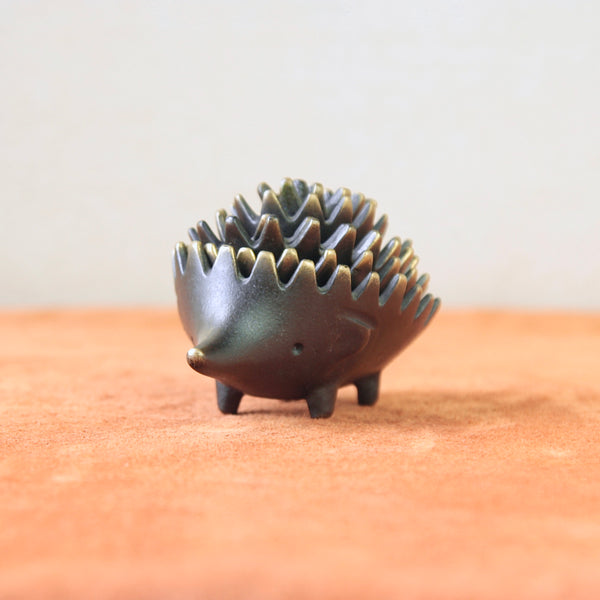 This vintage Walter Bosse genuine hedgehog ashtray is a rare find in Mid Century collectibles. Crafted with Bosse’s distinctive Modernist style, it’s an iconic piece of Viennese design.