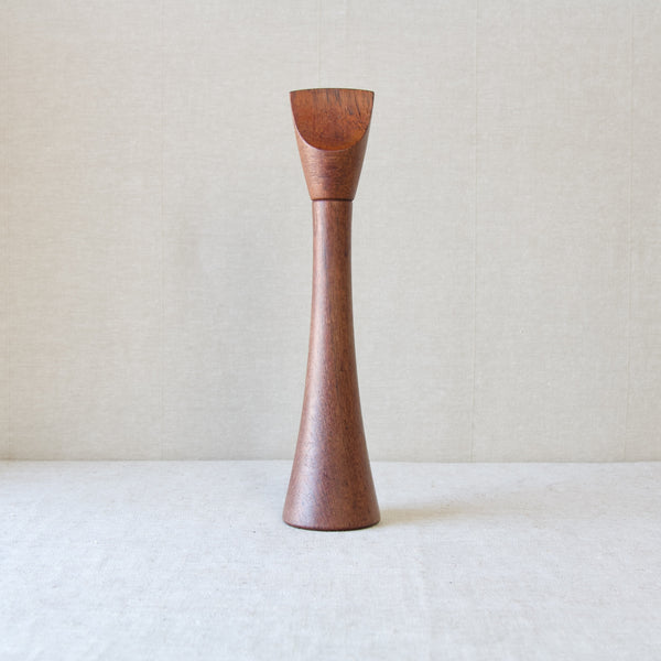 Head on shot of a tall sculptural pepper mill. This elegant and slender Scandinavian design is by Jens Quistgaard who produced approximately 60 others for Dansk Designs Ltd.  