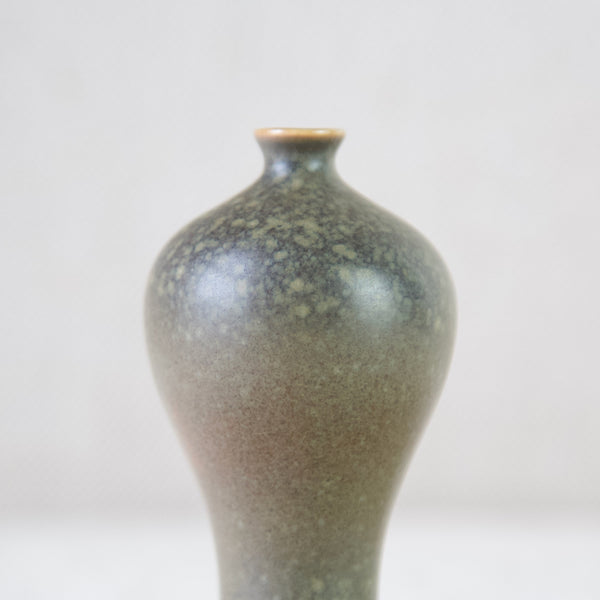 detail of dappled glaze on Annikki Hovisaari miniature green and brown vase