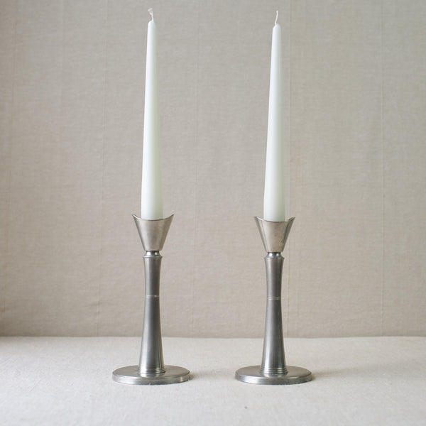 Collectible sleek pewter candlesticks by GAB Tenn in the Swedish Grace style. A rare find from mid-century Scandinavian design. Available for sale at Art & Utility.