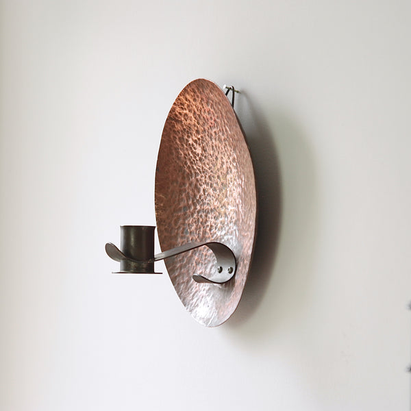 Concave copper wall sconce from Britain, circa 1910, a beautiful example of the arts & crafts movement.