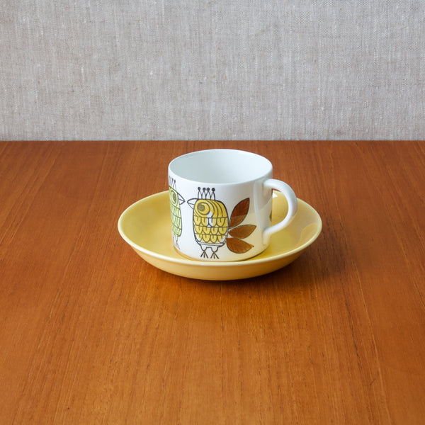 A Marianne Westman ‘King’ cup and saucer for Rörstrand, the set's production between 1964 and 1965 adds historical significance, marking it as a genuine representation of mid-century Swedish design trends.