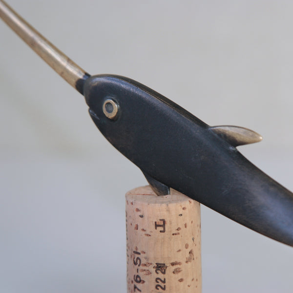 Austrian-designed narwhal letter opener by Richard Rohac, available at Art and Utility in London. A blend of midcentury elegance and whimsical charm.