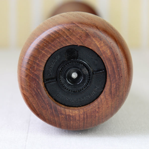 View of base and grinding mechanism on a collectible Scandinavian teak pepper mill, Jens Quistgaard model 893, an early production piece made in Denmark.