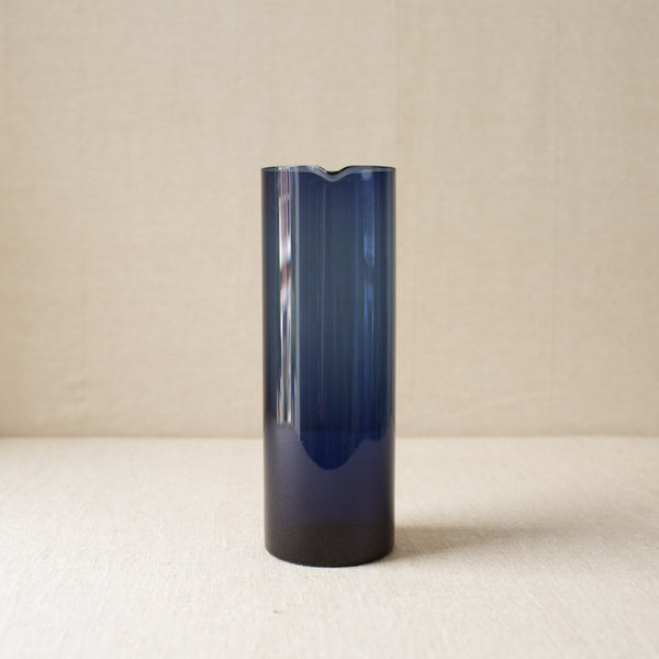 Collectible deep blue glass pitcher by Kaj Franck, awarded the 1957 Milan Grand Prix. A rare Nordic design masterpiece for the discerning collector.