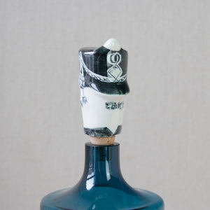 Parkinson Pottery's grenadier guard bottle stopper, designed by Guy Neale in 1954, showcases modernist elements in post-war British art.