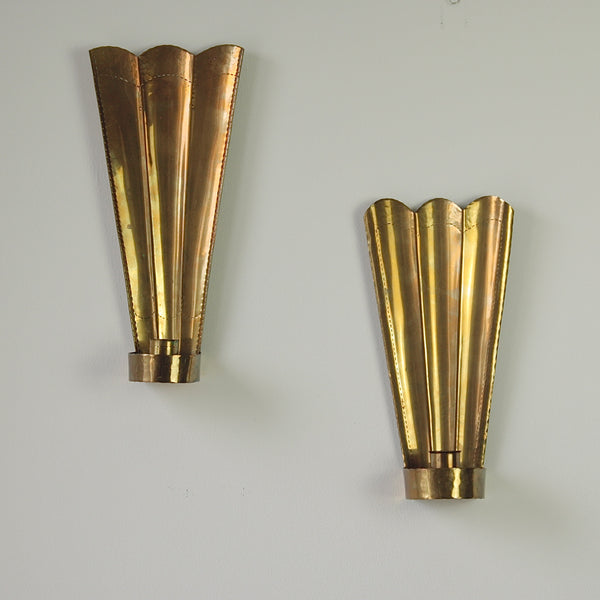 Swedish brass wall sconces by Carl Malmstedt, inspired by the Three Crowns emblem, handcrafted in 1932 and 1933, showcasing nordic design.