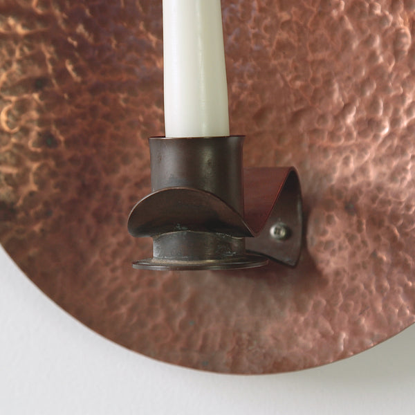 Hammered copper wall sconce, a beautiful piece of arts and crafts design from early 20th-century Britain.