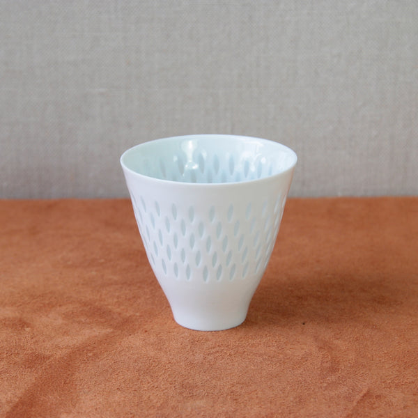 Vintage Finnish porcelain vase with rice grain design by Friedl Holzer-Kjellberg, a perfect addition to any collection of Nordic ceramics. Now for sale at Art & Utility, London.