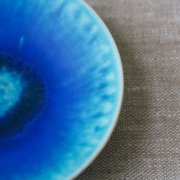 Detail of bright blue and aqua glaze on collectable Scandinavian design dish by Friedl Holzer-Kjellberg, Arabia, Finland.