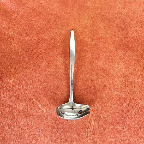 Forged stainless steel sauce ladle from a flatware set Dansk Variations V by Jens Quistgaard, a large and complete 80-piece collection showcasing Nordic design.