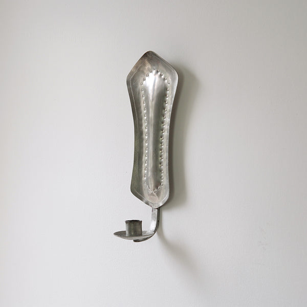 Diamond-shaped pewter wall sconce, a nordic design masterpiece from the 1940s, part of 20th-century Finnish pewter art.