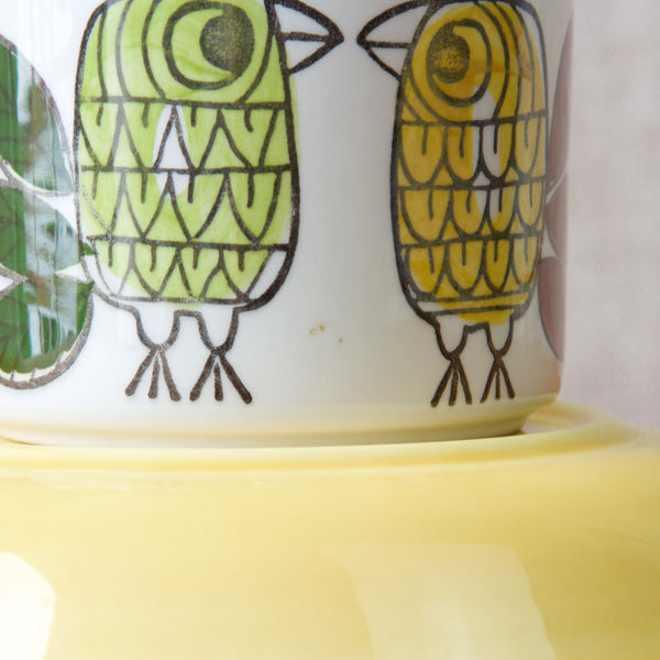 Marianne Westman's 'King' pattern for the famous Mid-20th century ceramics manufacturer Rörstrand features a striking design inspired by nature, showcasing a regal motif of birds and foliage in vibrant colours.