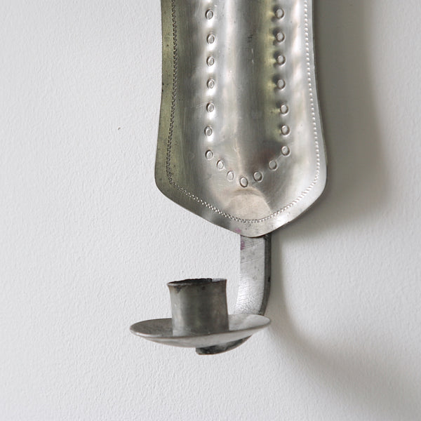 Concentric pewter wall sconce from 1940, a beautiful example of twentieth-century Finnish metalware and mid-century Scandinavian design.