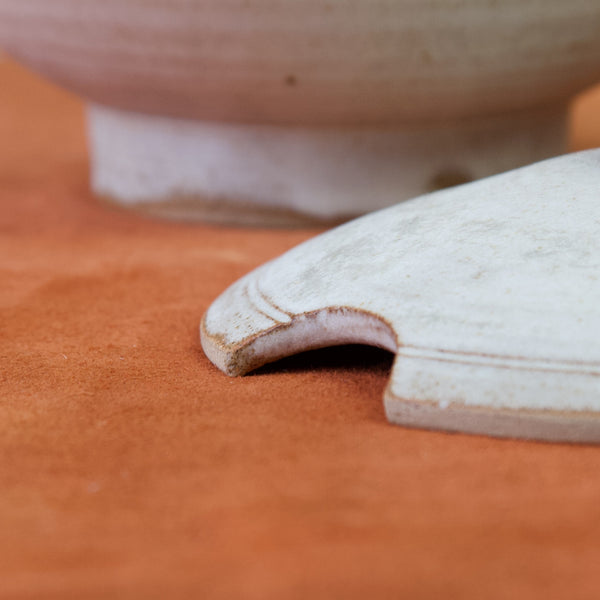 Emmanuel cooper's early stoneware tureen with greco-roman inspired design from the 1960s.