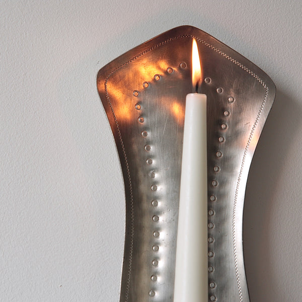 Handcrafted pewter wall sconce from the 1940s, a beautiful example of mid-century Scandinavian design and nordic craftsmanship.