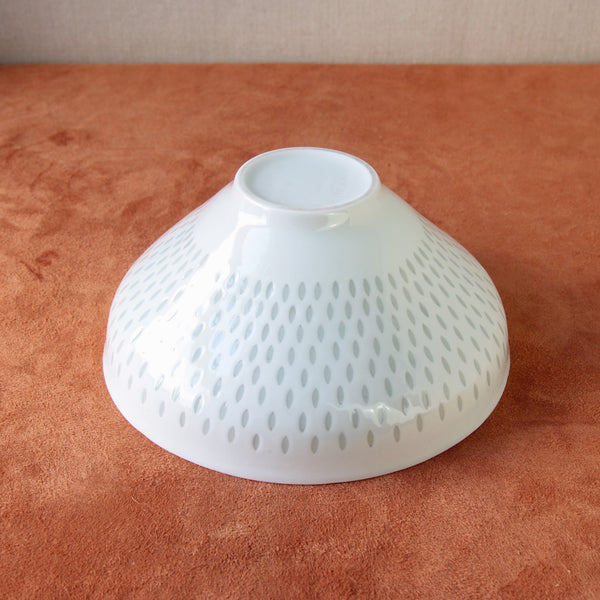 Finnish porcelain bowl with rice grain technique by Friedl Holzer-Kjellberg, an iconic vintage Scandinavian design piece.