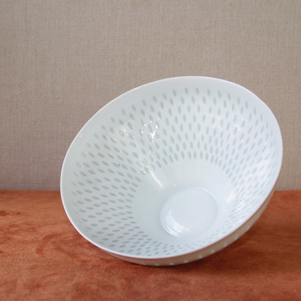 Pierced porcelain bowl by Friedl Holzer-Kjellberg featuring a rice grain pattern, a notable example of midcentury vintage design.