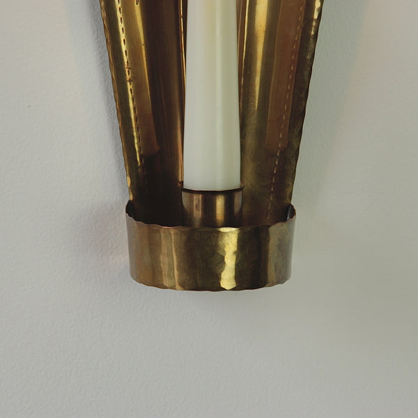 Drip tray and candle holder on a mid-century Scandinavian wall sconce made in brass by Carl Malmstedt.