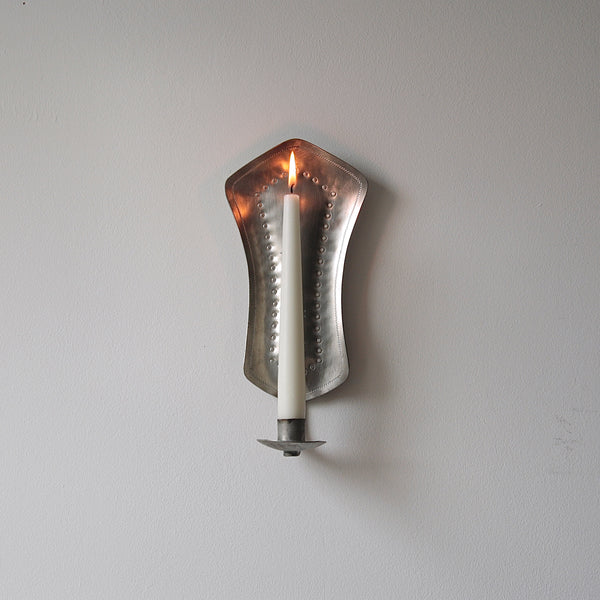 Finnish naïve handcrafted wall sconce in pewter, reflecting nordic design and 20th-century Finnish metalware traditions.