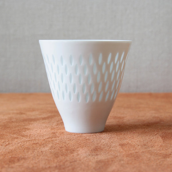 Vintage porcelain vase by Friedl Holzer-Kjellberg, showcasing a handmade rice grain design that reflects Nordic aesthetics. For sale at Art & Utility in London.