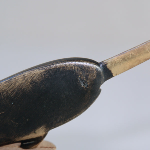 Back stamp, makers mark on the reverse of a rare 1950s Richard Rohac narwhal letter opener, available at Art and Utility in London. This midcentury modern brass piece showcases timeless elegance.