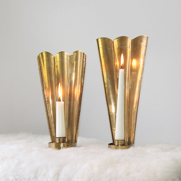 Handcrafted brass wall sconces by Carl Malmstedt, inspired by the Three Crowns emblem of Sweden, from 1932 and 1933, reflecting nordic design.