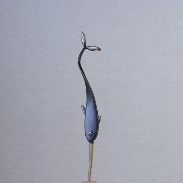 Brass narwhal letter opener by Richard Rohac. This midcentury collectible is perfect for those with a taste for sophisticated design.