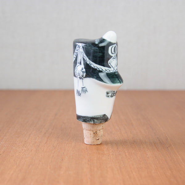 The grenadier guard bottle stopper from Parkinson Pottery is a collectible piece in the Picassoettes series, highlighting modernist influences.