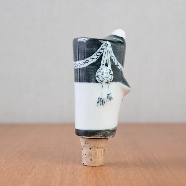 The 1954 grenadier guard bottle stopper, inspired by James Tower, reflects the artistic direction of Parkinson Pottery and post-war British design.