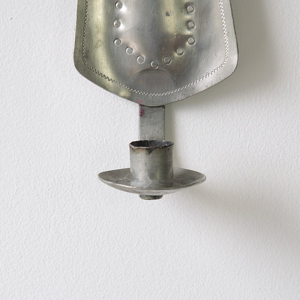 Concave pewter wall sconce from the 1940s, showcasing mid-century Scandinavian design and twentieth-century Finnish metalware.