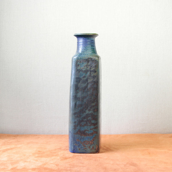 A tall vintage vase from Arabia Finland, designed by Francesca Mascitti Lindh in the 1960s, blending art and utility with a striking glaze.