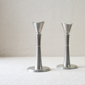 Collectible Swedish Grace pewter candlesticks by GAB Tenn. Antique mid-century pieces for sale in London at Art & Utility. Perfect for lovers of Scandinavian design.